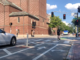 A cyclist rides through the intersection of Mt. Auburn and DeWolfe streets in Cambridge.