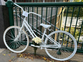 A photo of John Corcoran's ghost bike on Memorial Drive